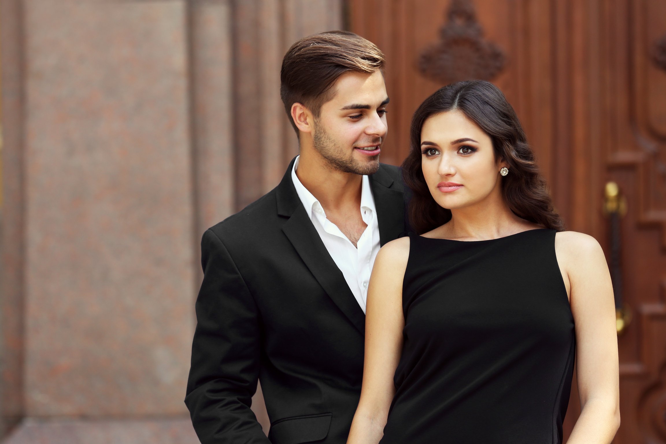 Portrait of a Couple in Formalwear Posing Outdoors